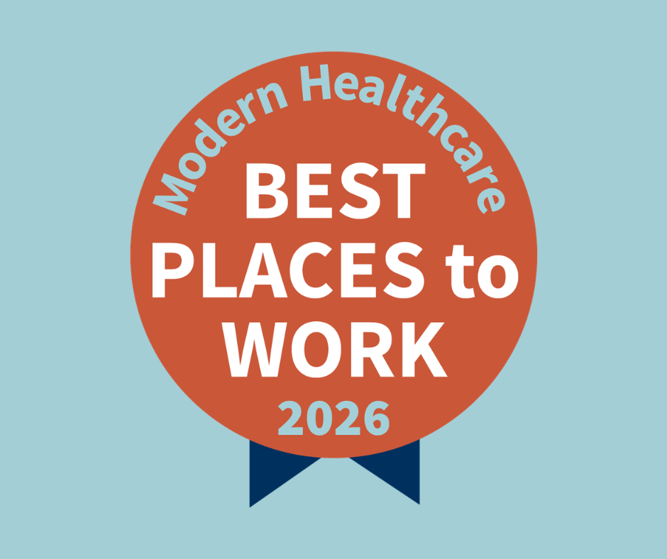 Badge reading 'BEST PLACES to WORK' with '2026' on an orange circle, 'Modern Healthcare' arc at top, blue ribbons, on a light blue background (award badge).